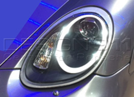 KOPLAMP PROJECTOR HALOGEEN + AURORA LICHT Porsche 987 05-08 ZWART LENS RHD - 99763115713, 99763115813